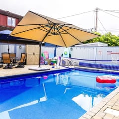 Private heated pool in back & Sandy beach in front